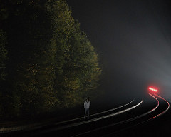 standing on railroad tracks watching EOT flash